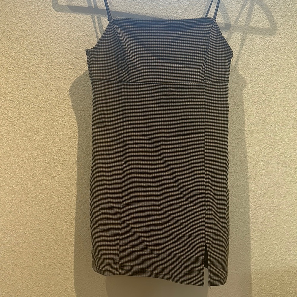 Plaid mini dress usually worn with black or white shirt under